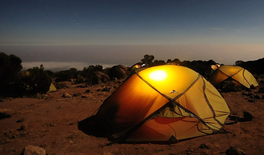 Night camp with orange tent